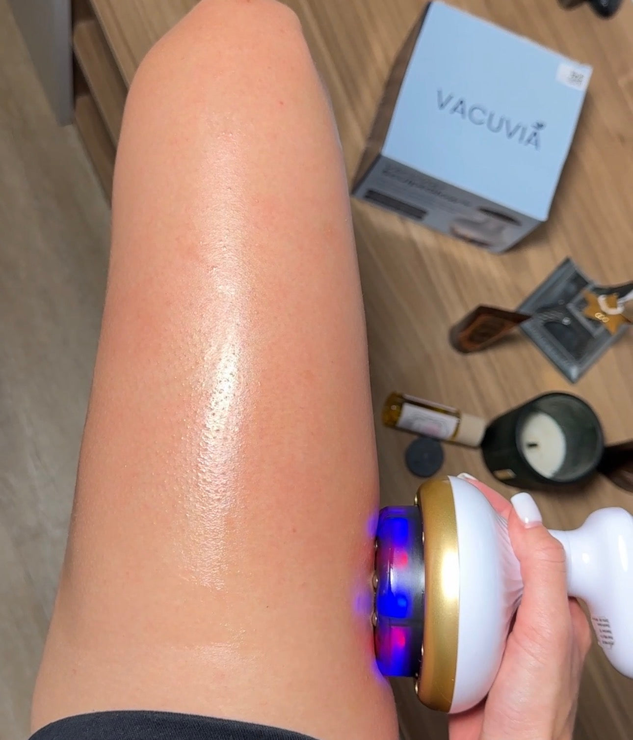 Vacuvia massage device being used on the leg during a daily skin care and self-care routine.